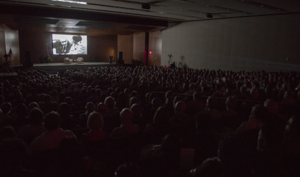 people watching a film screening