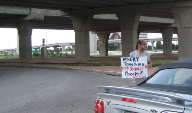 man holding sign