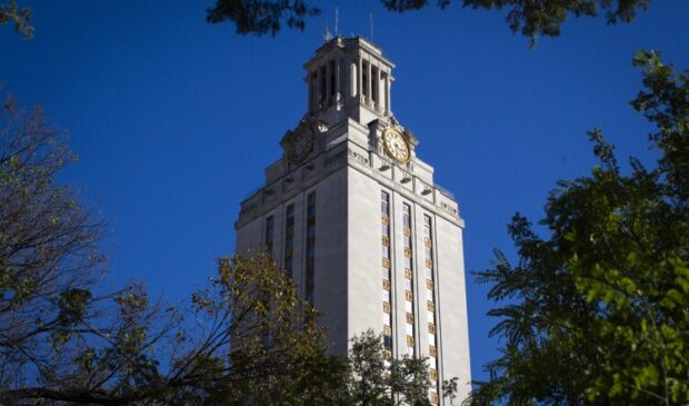 The UT tower against a blue sky.